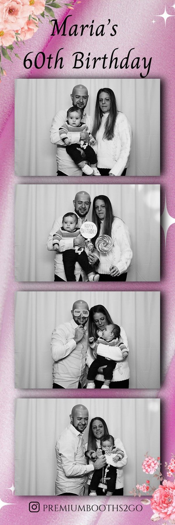 A happy family poses with a baby and teddy bear in a photo booth.