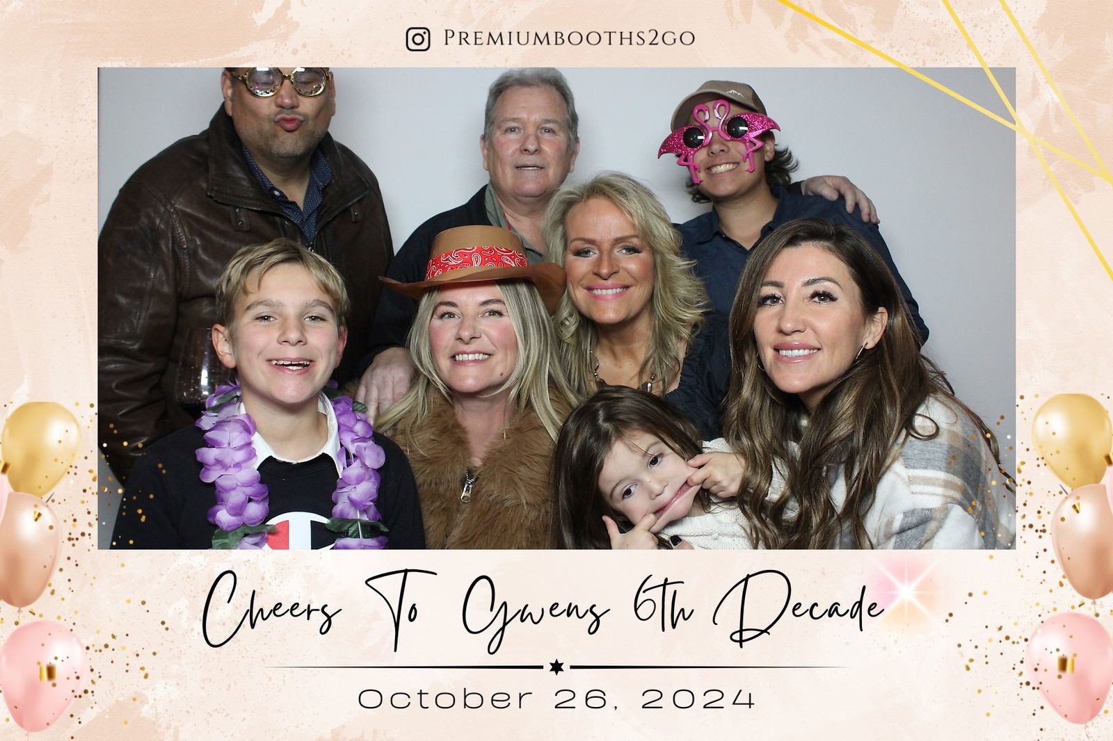 Family celebrating a 60th birthday with smiles and festive attire.