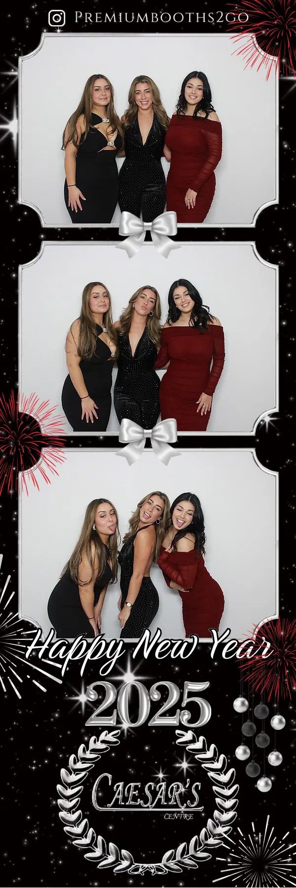 Three women posing stylishly in elegant dresses at a photo booth.