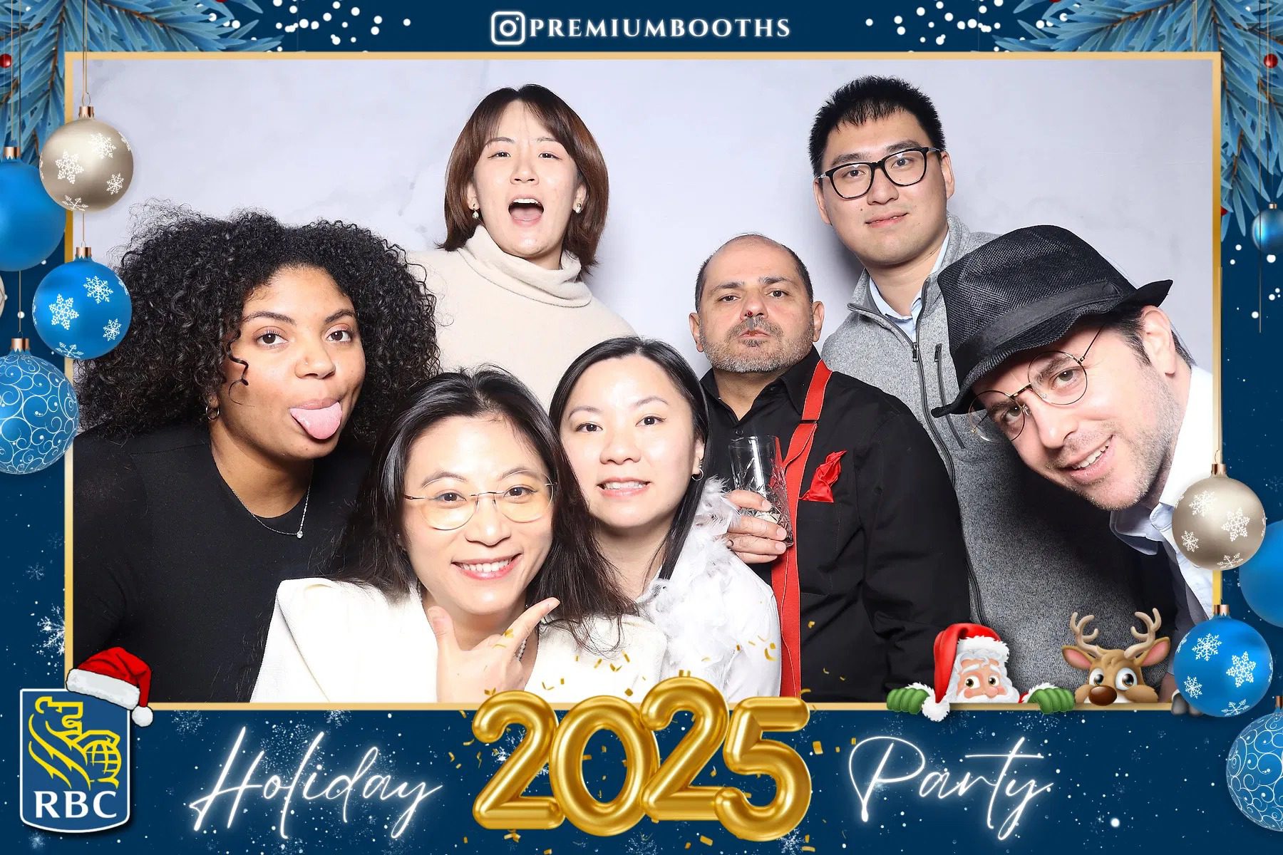 Group of six friends posing at a 2025 holiday party photo booth.
