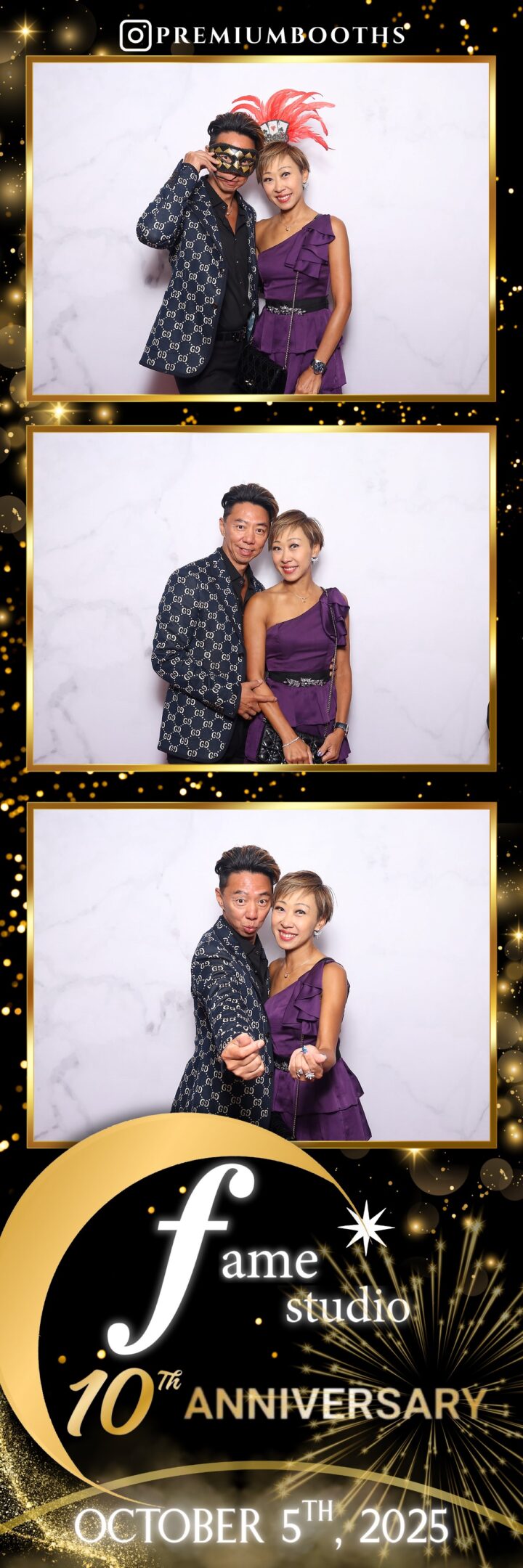 A couple poses stylishly in front of a white backdrop.